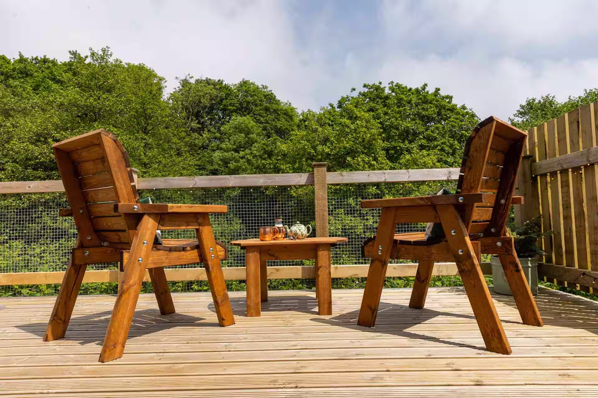 Fern Cabin Decking with Seats Overlooking Meadow